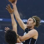 
              Orlando Magic's Robin Lopez, right, shoots over Cleveland Cavaliers' Jarrett Allen in the first half of an NBA basketball game, Saturday, Nov. 27, 2021, in Cleveland. (AP Photo/Tony Dejak)
            