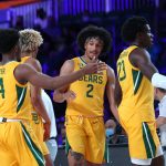 
              In a photo provided by Bahamas Visual Services, Baylor guard Kendall Brown greets teammates returning to the bench during an NCAA college basketball game against Arizona State at Paradise Island, Bahamas, Wednesday, Nov. 24, 2021. (Tim Aylen/Bahamas Visual Services via AP)
            