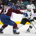 
              San Jose Sharks right wing Nick Merkley, right, picks up the puck as Colorado Avalanche right wing Valeri Nichushkin defends during the second period of an NHL hockey game Saturday, Nov. 13, 2021, in Denver. (AP Photo/David Zalubowski)
            