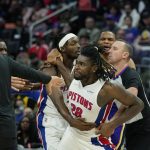 
              Detroit Pistons center Isaiah Stewart (28) is held back after a foul during the second half of an NBA basketball game against the Los Angeles Lakers, Sunday, Nov. 21, 2021, in Detroit. (AP Photo/Carlos Osorio)
            