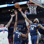 
              Washington Wizards guard Bradley Beal (3) goes up for a rebound against New Orleans Pelicans forward Brandon Ingram (14) and forward Herbert Jones (5) in the first half of an NBA basketball game in New Orleans, Wednesday, Nov. 24, 2021. (AP Photo/Gerald Herbert)
            