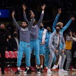 
              The Charlotte Hornets react after forward Miles Bridges (0) scored a three pointer to tie the game during the second half of an NBA basketball game against the Los Angeles Lakers in Los Angeles, Monday, Nov. 8, 2021. (AP Photo/Ashley Landis)
            