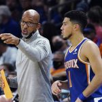 
              Phoenix Suns head coach Monty Williams, left, talks with guard Devin Booker during the second half of the team's NBA basketball game against the Houston Rockets on Thursday, Nov. 4, 2021, in Phoenix. The Suns won 123-111. (AP Photo/Ross D. Franklin)
            