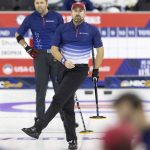 
              Team Dropkin's Joe Polo reacts to the curl of the rock he threw while competing against Team Shuster during the third night of finals at the U.S. Olympic Curling Team Trials at Baxter Arena in Omaha, Neb., Sunday, Nov. 21, 2021. (AP Photo/Rebecca S. Gratz)
            