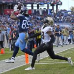 
              Tennessee Titans tight end MyCole Pruitt, left, scores a touchdown ahead of New Orleans Saints defensive back J.T. Gray in the second half of an NFL football game Sunday, Nov. 14, 2021, in Nashville, Tenn. (AP Photo/John Amis)
            