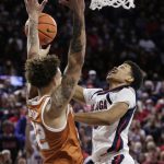 
              Gonzaga guard Rasir Bolton, right, shoots while pressured by Texas forward Christian Bishop during the first half of an NCAA college basketball game Saturday, Nov. 13, 2021, in Spokane, Wash. (AP Photo/Young Kwak)
            