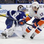 
              New York Islanders' Mathew Barzal (13) scores past Tampa Bay Lightning goaltender Andrei Vasilevskiy during the first period of an NHL hockey game Monday, Nov. 15, 2021, in Tampa, Fla. (AP Photo/Mike Carlson)
            