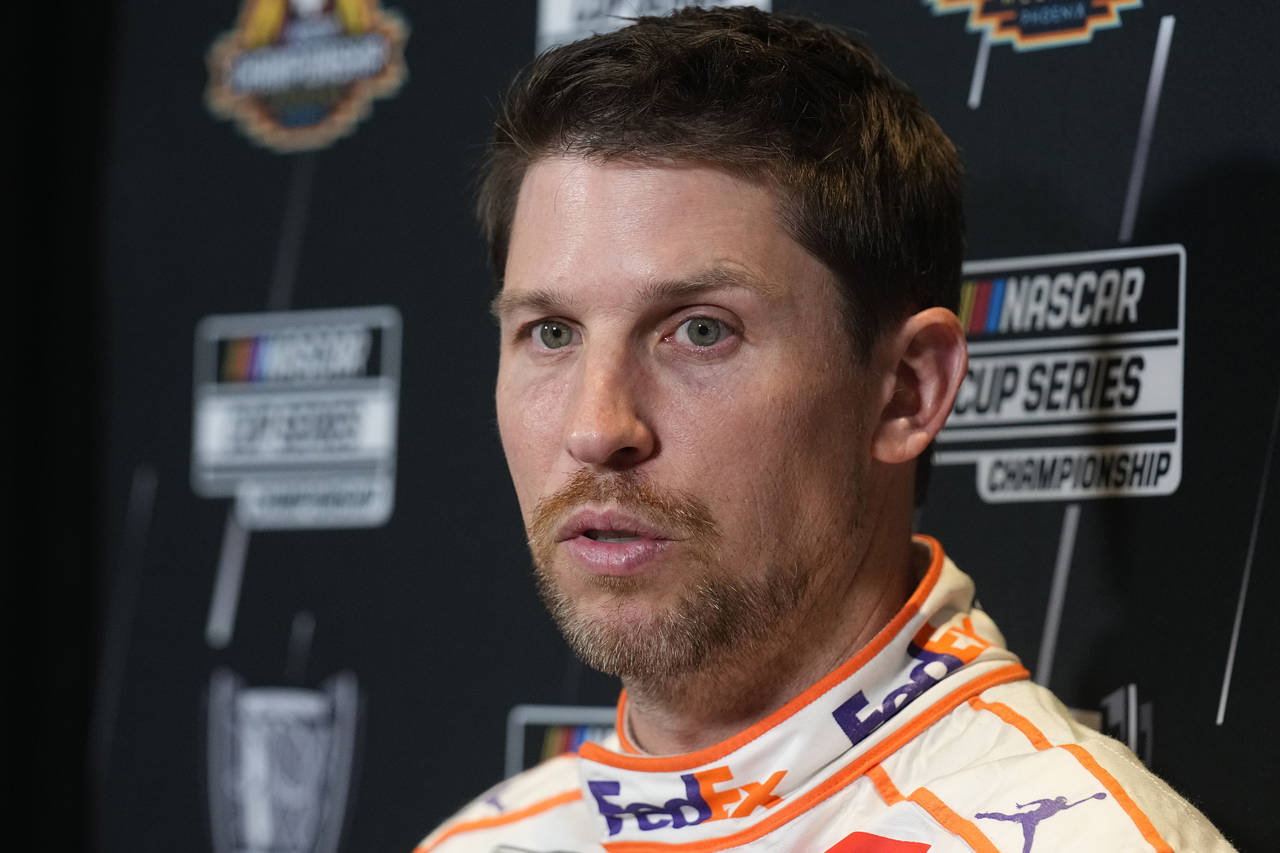 Driver Denny Hamlin speaks during media day ahead of Sunday's NASCAR Cup Series championship auto r...
