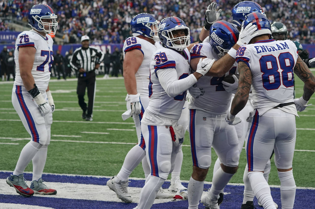 New York Giants' Chris Myarick (41), second from right, celebrates his touchdown during the second ...