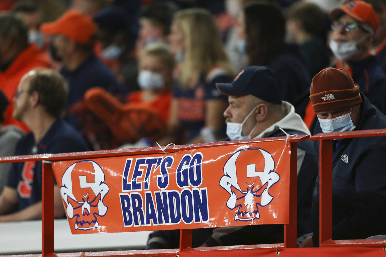 A sign reading "Let's go Brandon" is displayed on the railing in the first half of an NCAA college ...