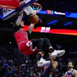 
              Chicago Bulls' Lonzo Ball dunks during the second half of an NBA basketball game against the Philadelphia 76ers, Wednesday, Nov. 3, 2021, in Philadelphia. (AP Photo/Matt Slocum)
            