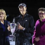 
              Garbiñe Muguruza, of Spain, center, holds the trophy accompanied by former tennis players Billie Jean King, right, and Chris Evert after defeating Anett Kontaveit, of Estonia, at the final match of the WTA Finals tennis tournament in Guadalajara, Mexico, Wednesday, Nov. 17, 2021. (AP Photo/Refugio Ruiz)
            