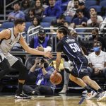 
              San Antonio Spurs guard Joshua Primo, left, defends against Orlando Magic guard Cole Anthony during the first half of an NBA basketball game Friday, Nov. 5, 2021, in Orlando, Fla. (AP Photo/Jacob M. Langston)
            