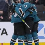 
              San Jose Sharks center Nick Bonino (13) celebrates with Logan Couture, left, and another teammate after scoring a goal against the Ottawa Senators during the second period of an NHL hockey game Wednesday, Nov. 24, 2021, in San Jose, Calif. (AP Photo/Tony Avelar)
            