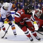 
              New York Islanders right wing Kyle Palmieri (21) looks to shoot against New Jersey Devils goaltender Mackenzie Blackwood (29) during the second period of an NHL hockey game Thursday, Nov. 11, 2021, in Newark, N.J. (AP Photo/Adam Hunger)
            