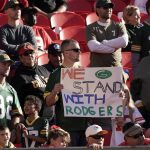 
              A fan holds a sign in support of Green Bay Packers quarterback Aaron Rodgers before the start of an NFL football game between the Kansas City Chiefs and the Green Bay Packers Sunday, Nov. 7, 2021, in Kansas City, Mo. (AP Photo/Charlie Riedel)
            