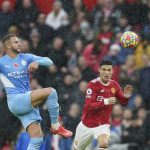
              Manchester City's Kyle Walker, left, challenges for the ball with Manchester United's Cristiano Ronaldo during the English Premier League soccer match between Manchester United and Manchester City at Old Trafford stadium in Manchester, England, Saturday, Nov. 6, 2021. (AP Photo/Jon Super)
            