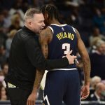 
              Denver Nuggets head coach Michael Malone talks with guard Bones Hyland (3) in the second half of an NBA basketball game Monday, Nov. 1, 2021, in Memphis, Tenn. (AP Photo/Brandon Dill)
            