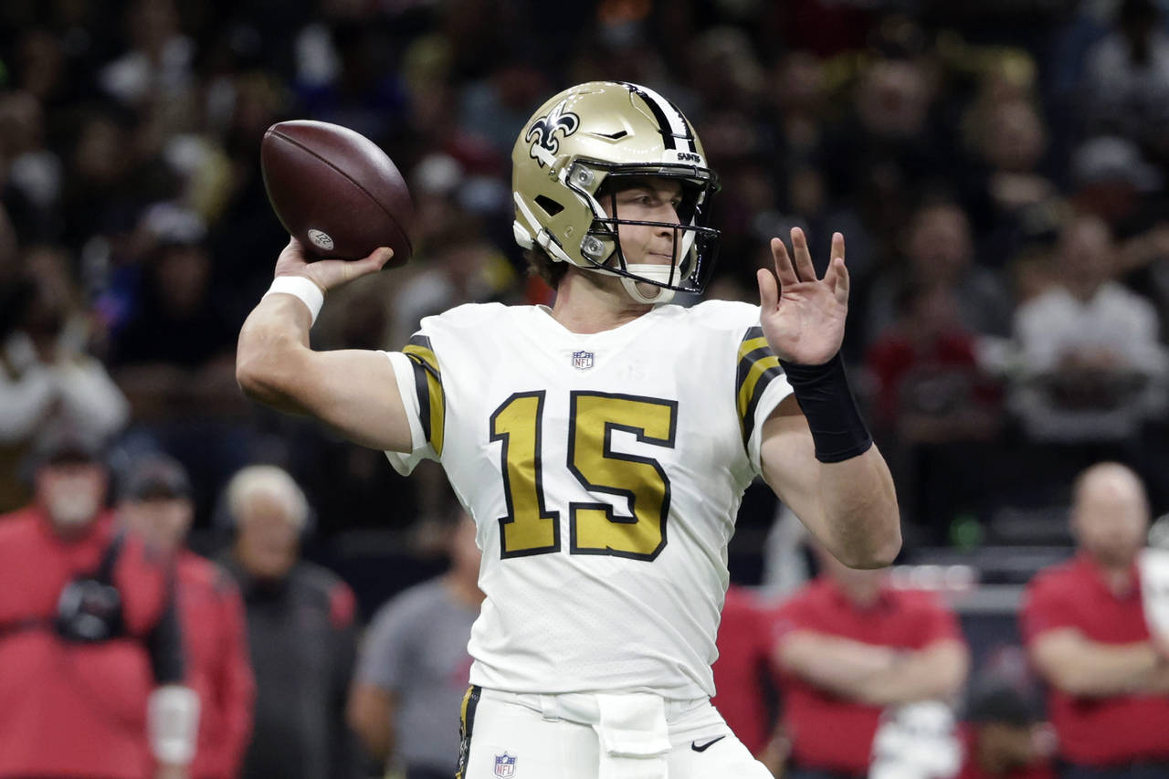 New Orleans Saints quarterback Trevor Siemian (15) passes in the first half of an NFL football game...