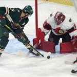 
              Ottawa Senators goalie Filip Gustavsson (32) makes a stop as Minnesota Wild's Marcus Foligno (17) works on a rebound moments before scoring a goal during the first period of an NHL hockey game Tuesday, Nov. 2, 2021, in St. Paul, Minn. (AP Photo/Jim Mone)
            