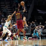 
              Cleveland Cavaliers guard Darius Garland (10) shoots a three point basket over Charlotte Hornets guard Kelly Oubre Jr. (12) during the first half of an NBA basketball game, Monday, Nov. 1, 2021, in Charlotte, N.C. (AP Photo/Matt Kelley)
            