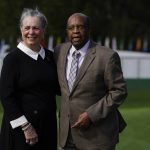 
              FILE - Lee Elder and his wife Sharon posed for a picture on the first tee at the Masters golf tournament Monday, Nov. 9, 2020, in Augusta, Ga. Elder broke down racial barriers as the first Black golfer to play in the Masters and paved the way for Tiger Woods and others to follow. The PGA Tour confirmed Elder’s death, which was first reported by Debert Cook of African American Golfers Digest. No cause or details were immediately available, but the tour said it spoke with Elder's family. He was 87. (AP Photo/Chris Carlson, File)
            