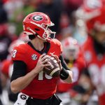 
              Georgia quarterback JT Daniels (18) looks for an open receiver in the second half of an NCAA college football game against Missouri on Saturday, Nov. 6, 2021, in Athens, Ga.. (AP Photo/John Bazemore)
            
