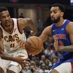 
              Cleveland Cavaliers' Evan Mobley (4) passes against Detroit Pistons' Trey Lyles (8) in the first half of an NBA basketball game, Friday, Nov. 12, 2021, in Cleveland. (AP Photo/Tony Dejak)
            