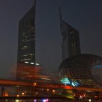 
              In a photograph taken with a slow shutter speed, bicyclists ride past the Museum of the Future and Emirates Towers in Dubai, United Arab Emirates, Friday, Nov. 5, 2021. The annual Dubai Ride saw authorities shut down the skyscraper-lined super highway that cuts through the center of the city-state to allow bicyclists to ride on it. Organizers say 32,750 people took part in the ride Friday. (AP Photo/Jon Gambrell)
            