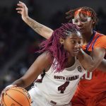 
              South Carolina forward Aliyah Boston (4) drives against Clemson center LaTrese Saine (40) during the first half of an NCAA college basketball game Wednesday, Nov. 17, 2021, in Columbia, S.C. (AP Photo/Sean Rayford)
            