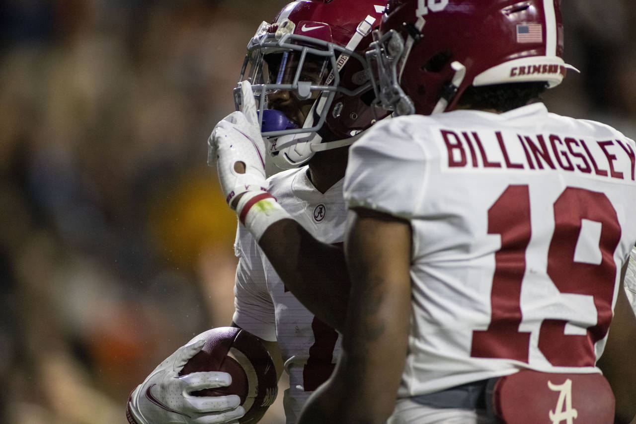 Alabama wide receiver Ja'Corey Brooks (7) reacts to the Auburn crowd after he scored a touchdown on...