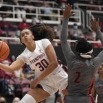 
              Stanford guard Haley Jones (30) looks to pass the ball as Morgan State guard Khaliah Hines (2) defends during the first half of an NCAA college basketball game in Stanford, Calif., on Thursday, Nov. 11, 2021. (AP Photo/Tony Avelar)
            