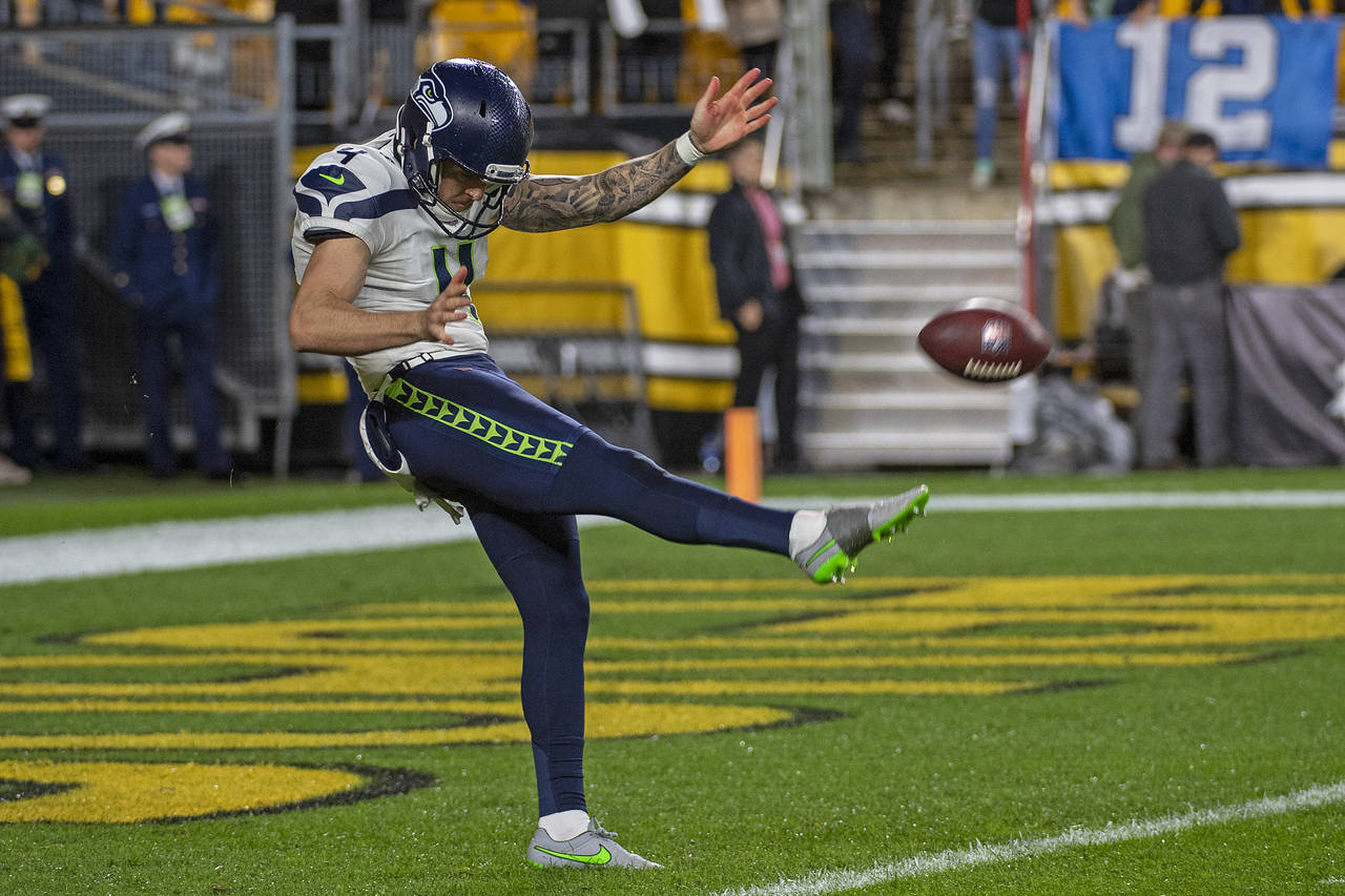 FILE - Seattle Seahawks punter Michael Dickson (4) warms up before an NFL football game against the...