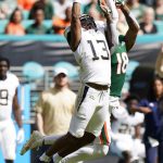 
              Georgia Tech defensive back Wesley Walker (13) can't hang on to a pass intended for Miami tight end Larry Hodges (18) during the first half of an NCAA college football game, Saturday, Nov. 6, 2021, in Miami Gardens, Fla. (AP Photo/Wilfredo Lee)
            