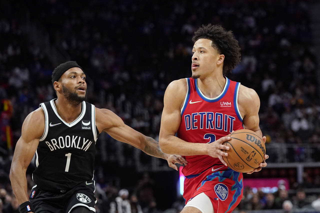 Detroit Pistons guard Cade Cunningham (2) is defended by Brooklyn Nets forward Bruce Brown (1) duri...