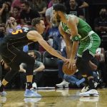 
              Miami Heat guard Duncan Robinson (55) defends Boston Celtics forward Jayson Tatum (0) during the first half of an NBA basketball game, Thursday, Nov. 4, 2021, in Miami. (AP Photo/Marta Lavandier)
            
