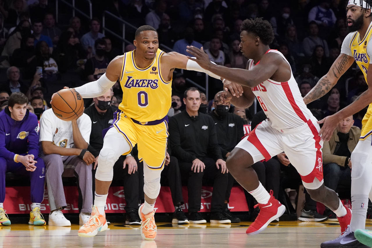 Los Angeles Lakers guard Russell Westbrook (0) is defended by Houston Rockets forward Jae'Sean Tate...