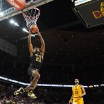 
              Alabama State guard Kenny Strawbridge (20) drives to the basket ahead of Iowa State guard Tristan Enaruna (23) during the second half of an NCAA college basketball game, Tuesday, Nov. 16, 2021, in Ames, Iowa. (AP Photo/Charlie Neibergall)
            
