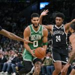 
              Boston Celtics forward Jayson Tatum (0) is pressured while driving against Brooklyn Nets forward James Johnson (16), guard Cam Thomas (24) and guard Patty Mills (8) during the first half of an NBA basketball game, Wednesday, Nov. 24, 2021, in Boston. (AP Photo/Charles Krupa)
            