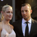 
              FILE - South African Olympic athlete Oscar Pistorius, right, and his girlfriend, the late Reeva Steenkamp, left, arrive at an awards ceremony in Johannesburg, South Africa. Nov. 4, 2012. Eight years after he shot dead his girlfriend, Pistorius is up for parole, but first he must meet with her parents as part of the parole procedure. A parole hearing for Pistorius was scheduled for last month and then canceled, partly because a meeting between Pistorius and Steenkamp's parents, Barry and June, had not been arranged, lawyers for both parties told The Associated Press on Monday, Nov. 8, 2021.  (Lucky Nxumalo/Citypress via AP, File)
            