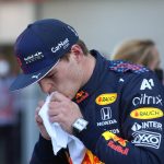 
              Red Bull driver Max Verstappen, of The Netherlands, wipes his mouth after coming in third in the qualifying run of the Formula One Mexico Grand Prix auto race at the Hermanos Rodriguez racetrack in Mexico City, Saturday, Nov. 6, 2021. (Edgard Garrido, Pool Photo via AP)
            