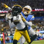 
              Pittsburgh Steelers wide receiver Diontae Johnson (18) makes a catch in the end zone for a touchdown as Los Angeles Chargers cornerback Asante Samuel Jr. defends during the first half of an NFL football game as Sunday, Nov. 21, 2021, in Inglewood, Calif. (AP Photo/Ashley Landis)
            