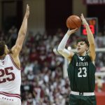
              Eastern Michigan forward Thomas Binelli (23) shoots over Indiana forward Race Thompson (25) during the first half of an NCAA college basketball game in Bloomington, Ind., Tuesday, Nov. 9, 2021. (AP Photo/AJ Mast)
            