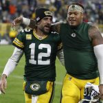 
              Green Bay Packers' Aaron Rodgers and Preston Smith walk off the field after an NFL football game against the Seattle Seahawks Sunday, Nov. 14, 2021, in Green Bay, Wis. The Packers won 17-0. (AP Photo/Matt Ludtke)
            