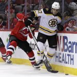 
              Boston Bruins defenseman Jakub Zboril (67) battles for the puck with New Jersey Devils left wing Tomas Tatar during the first period of an NHL hockey game Saturday, Nov. 13, 2021, in Newark, N.J. (AP Photo/Adam Hunger)
            