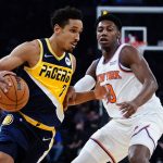 
              Indiana Pacers' Malcolm Brogdon (7) drives past New York Knicks' RJ Barrett (9) during the first half of an NBA basketball game Monday, Nov. 15, 2021, in New York. (AP Photo/Frank Franklin II)
            