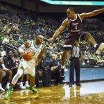 
              Oregon guard Rivaldo Soares (11) drives after getting Texas Southern guard Bryson Etienne (4) off his feet during the first half of an NCAA college basketball game Tuesday, Nov. 9, 2021, in Eugene, Ore. (AP Photo/Andy Nelson)
            