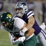 
              Baylor tight end Ben Sims (86) is tackled by Kansas State linebacker Austin Moore (41) during the first half of an NCAA college football game on Saturday, Nov. 20, 2021 in Manhattan, Kan. (AP Photo/Colin E. Braley)
            