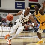 
              St. Bonaventure guard Kyle Lofton (0) drives to the hoop while defended by Canisius guard Ahamadou Fofana (1) during the first half of an NCAA college basketball game, Sunday, Nov. 14, 2021, in Olean N.Y. (AP Photo/Joshua Bessex)
            