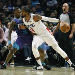 
              Los Angeles Clippers forward Paul George (13) dribbles against Charlotte Hornets guard Terry Rozier (3) during the first half of an NBA basketball game Sunday, Nov. 7, 2021, in Los Angeles. (AP Photo/Ringo H.W. Chiu)
            